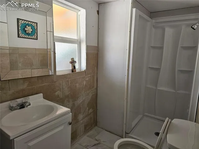 a bathroom with a sink and toilet