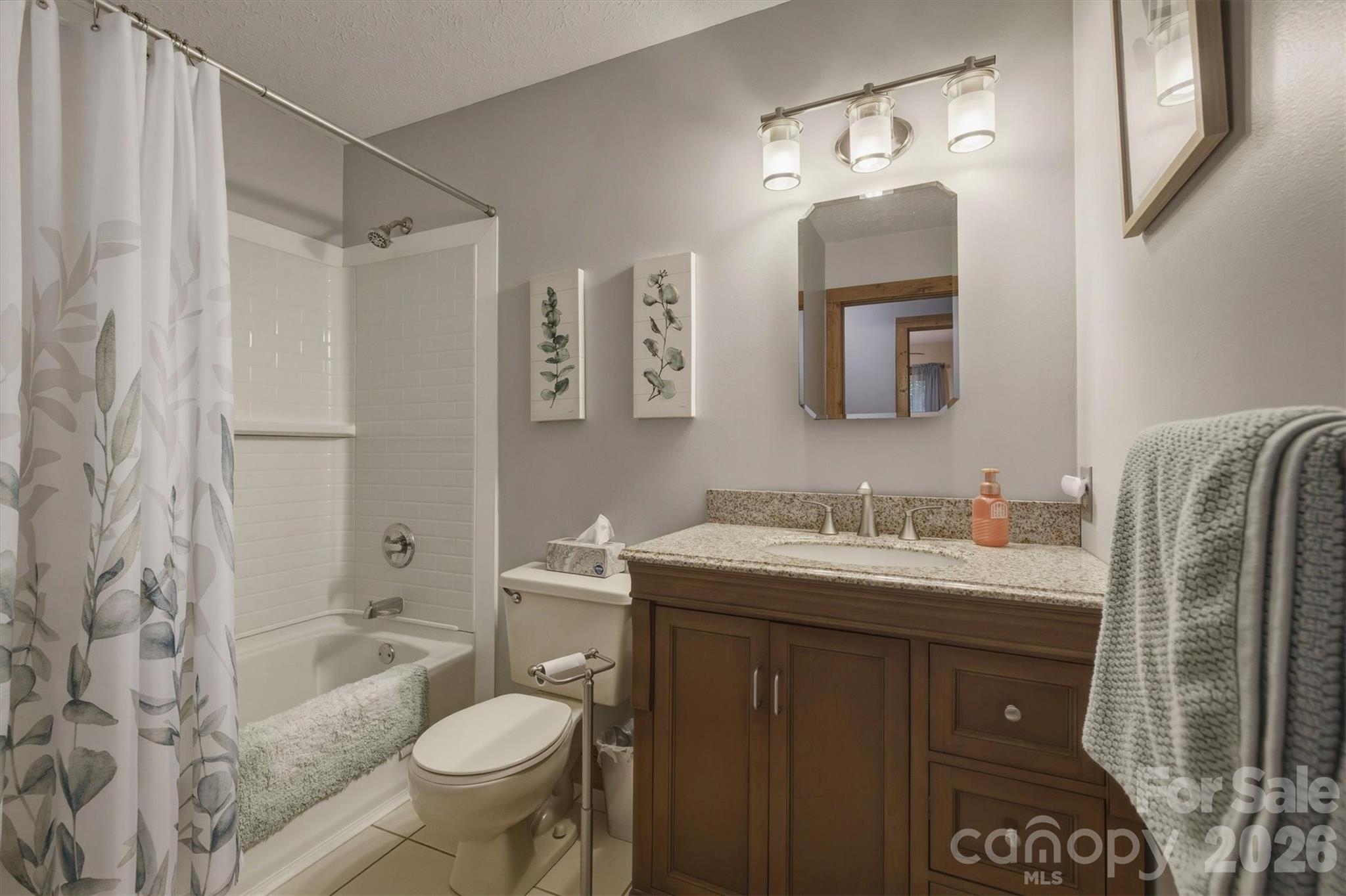 3432 Ridgewood Drive Morganton, NC 28655 - Photo 22 of 36 a bathroom with a granite countertop sink toilet and shower