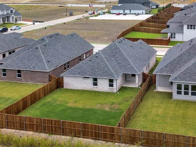 a aerial view of a house with swimming pool