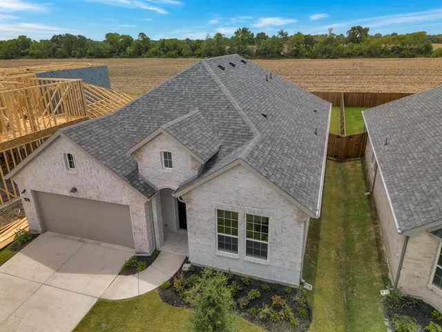 a aerial view of a house with a lake view