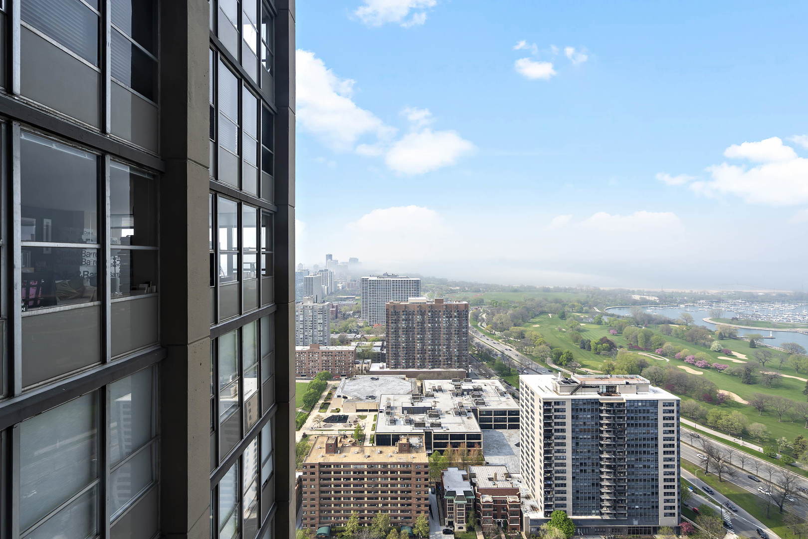 655 West Irving Park Road, Unit 4108 Chicago, IL 60613 - Photo 4 of 32 a city view with tall buildings