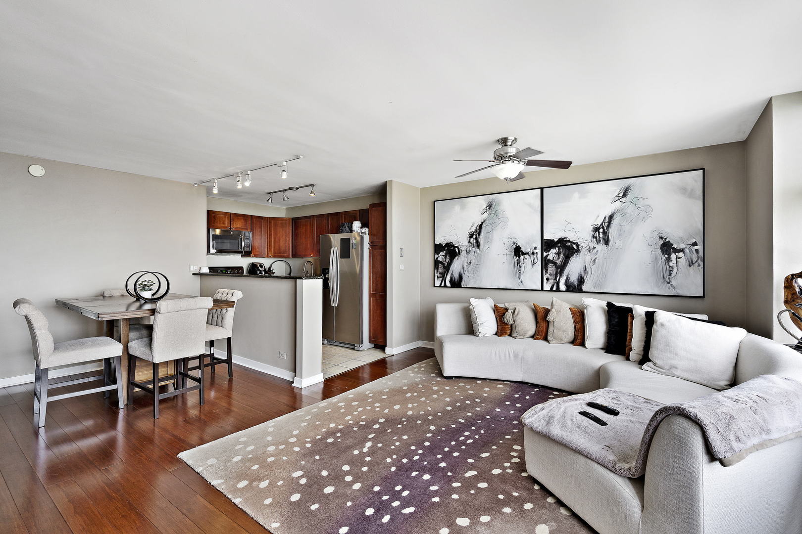 655 West Irving Park Road, Unit 4108 Chicago, IL 60613 - Photo 5 of 32 a living room with furniture and wooden floor