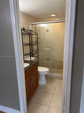 a bathroom with a shower and a toilet