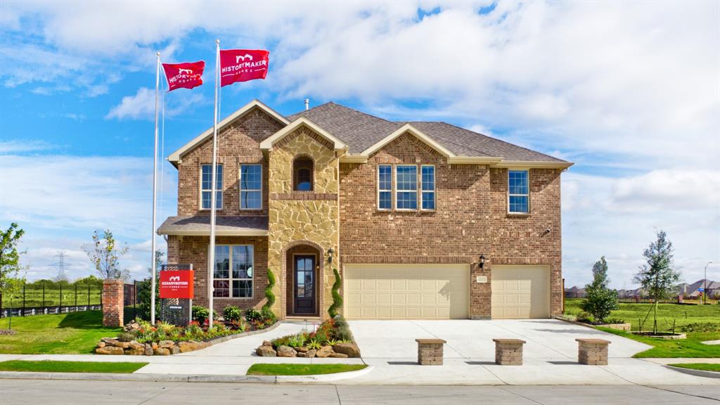 a view of multiple houses with a street