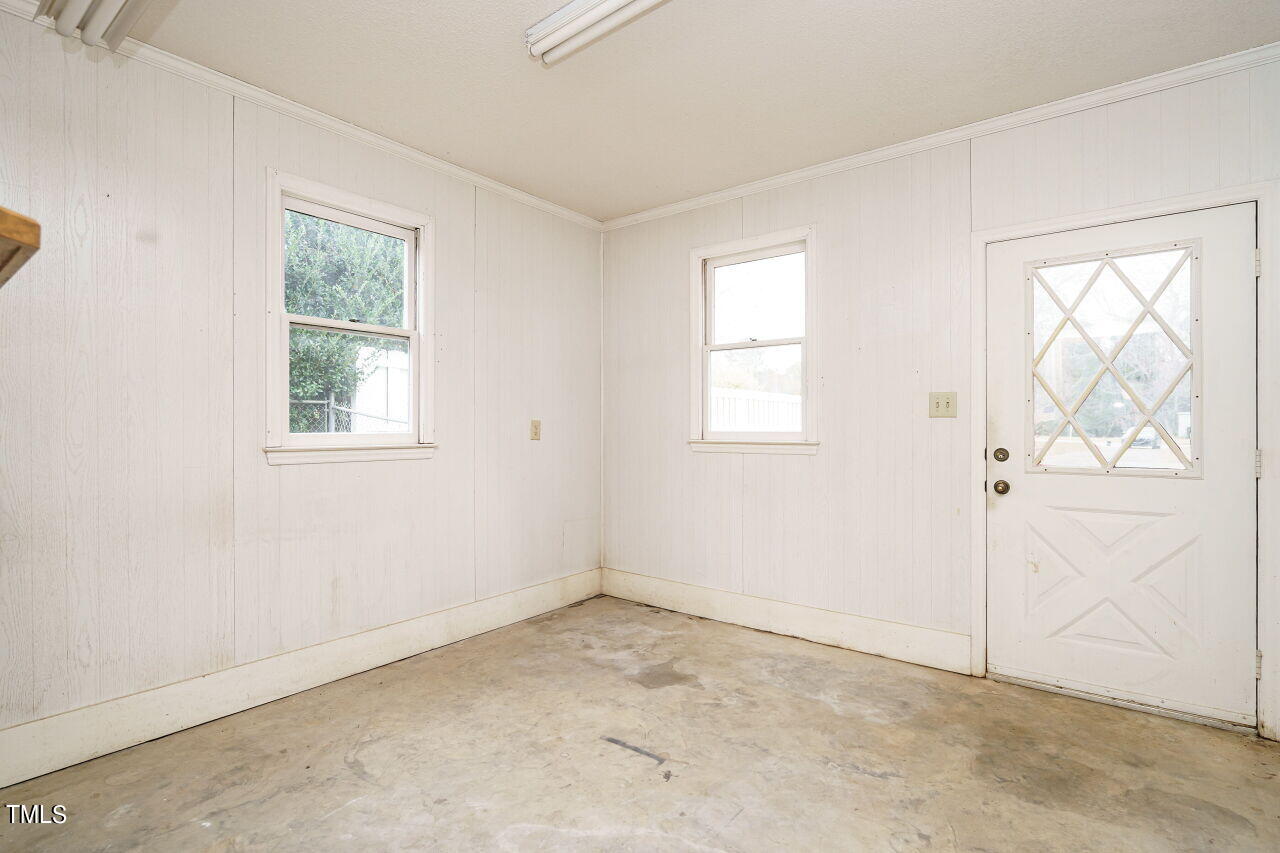 5917 Countryview Lane Raleigh, NC 27606 - Photo 20 of 43 The attached garage provides ample space for parking but also storage as well.
