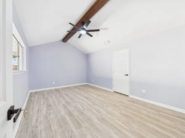 a bathroom with a toilet a sink and a large mirror