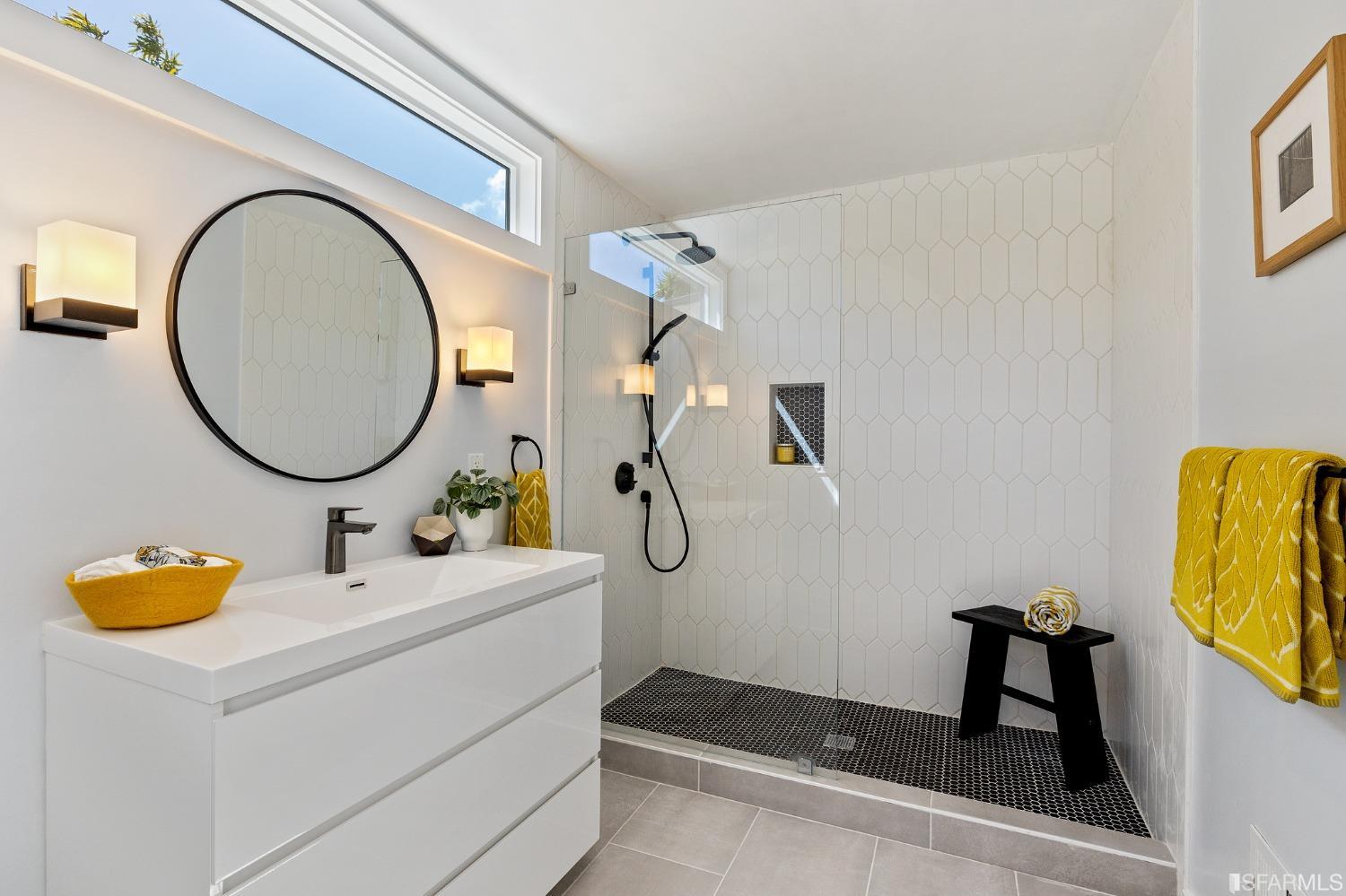 115 Wool Street San Francisco, CA 94110 - Photo 14 of 37 a bathroom with a sink mirror and vanity