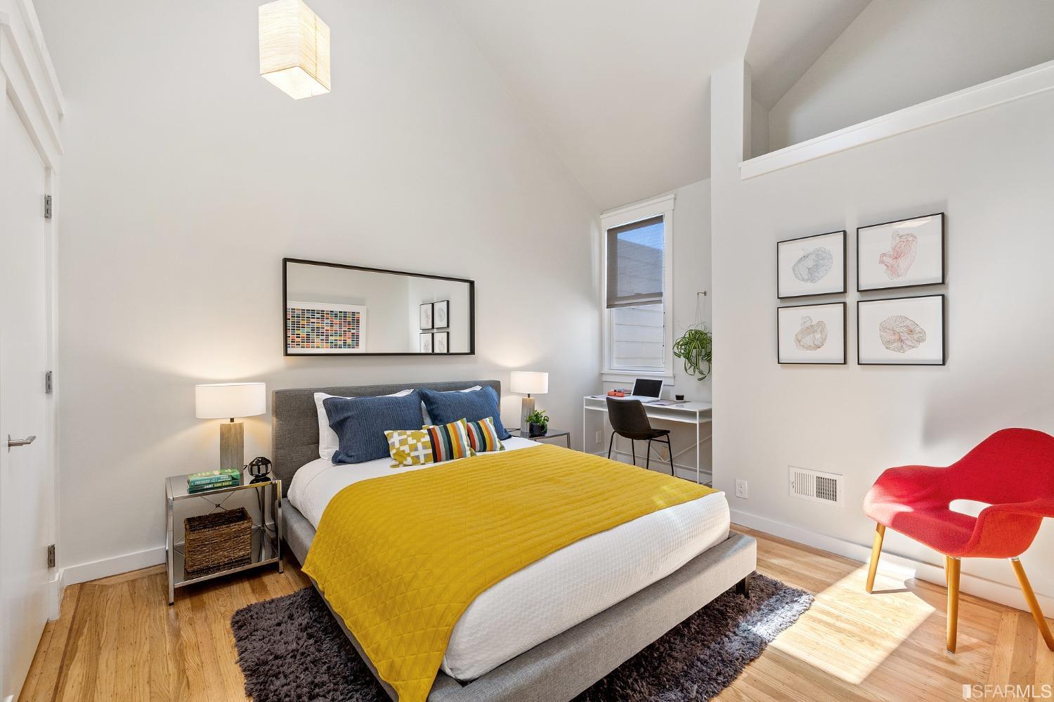 115 Wool Street San Francisco, CA 94110 - Photo 15 of 37 a bedroom with a bed a chair and a potted plant