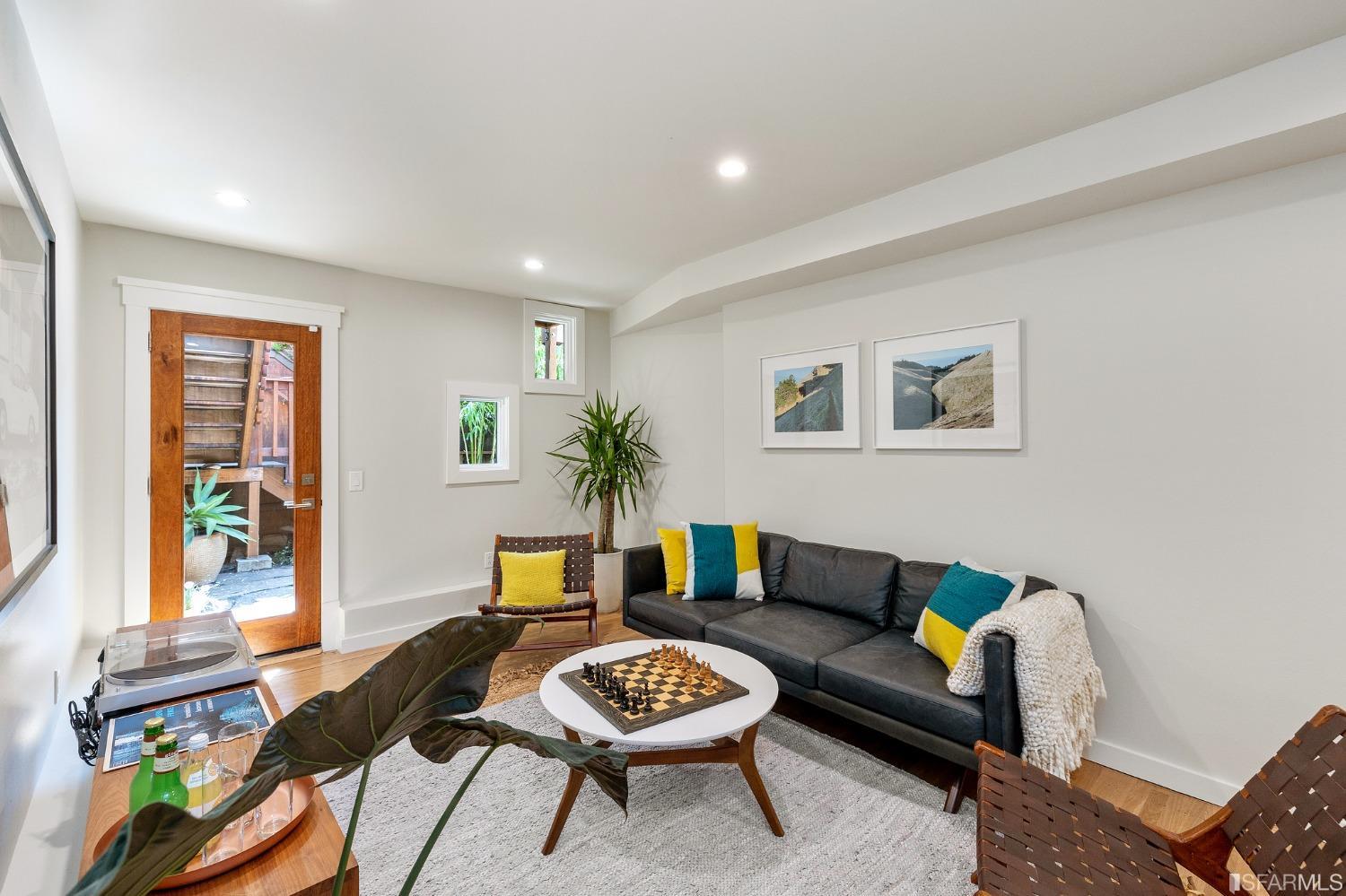 115 Wool Street San Francisco, CA 94110 - Photo 23 of 37 a living room with furniture and a potted plant