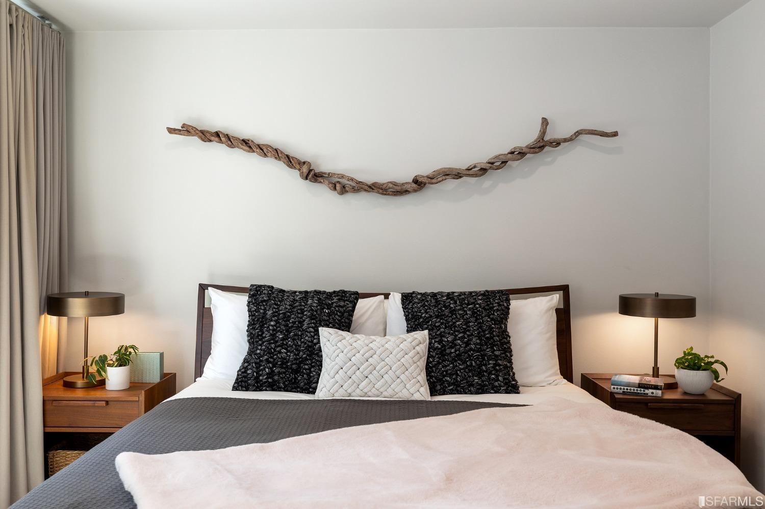 115 Wool Street San Francisco, CA 94110 - Photo 30 of 37 a bedroom with a bed and wooden floor