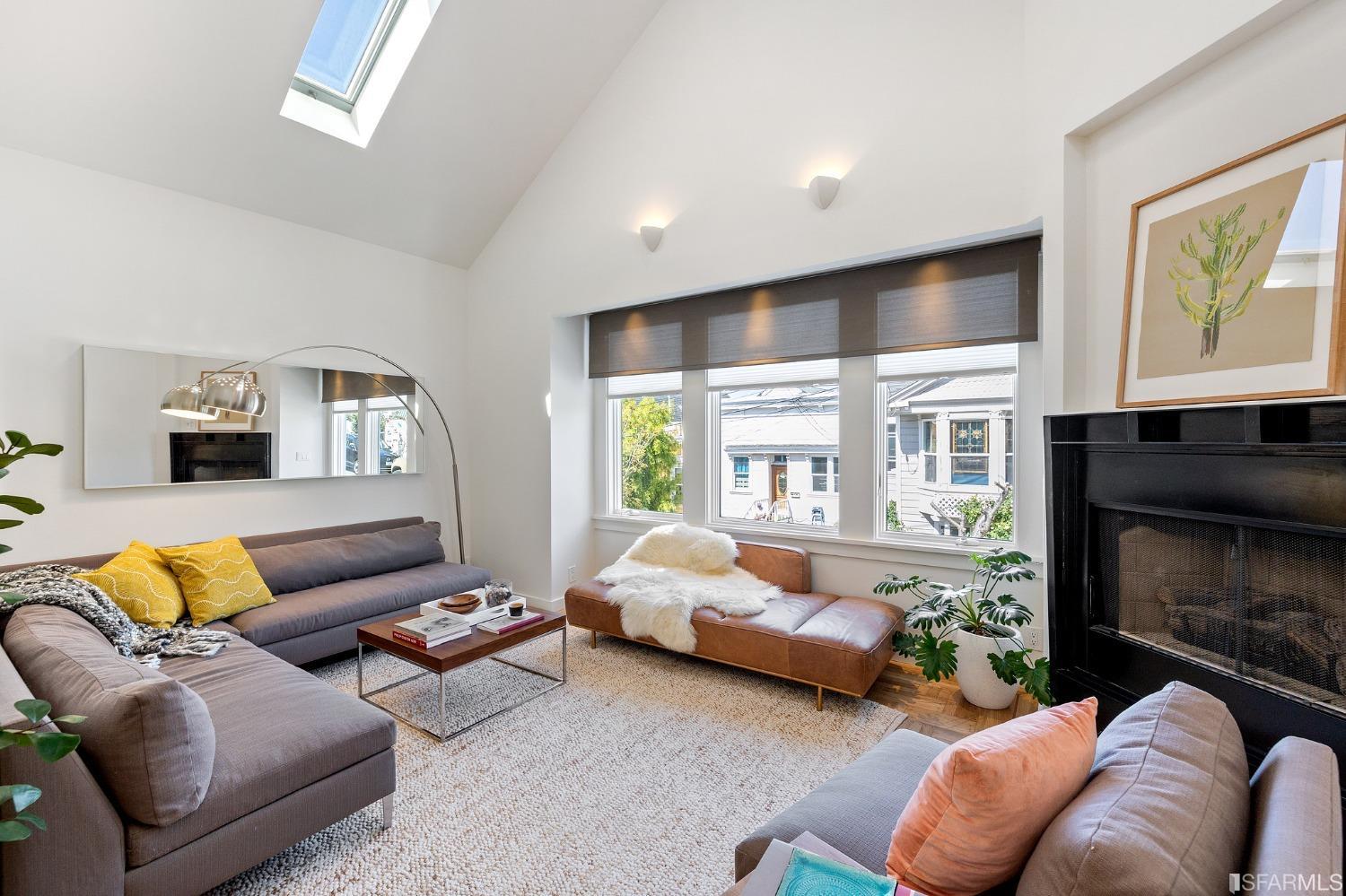 115 Wool Street San Francisco, CA 94110 - Photo 6 of 37 a bedroom with furniture and a fireplace