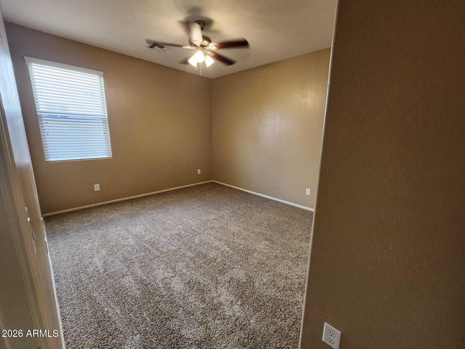 7643 West Charter Oak Road Peoria, AZ 85381 - Photo 15 of 27 an empty room with a window