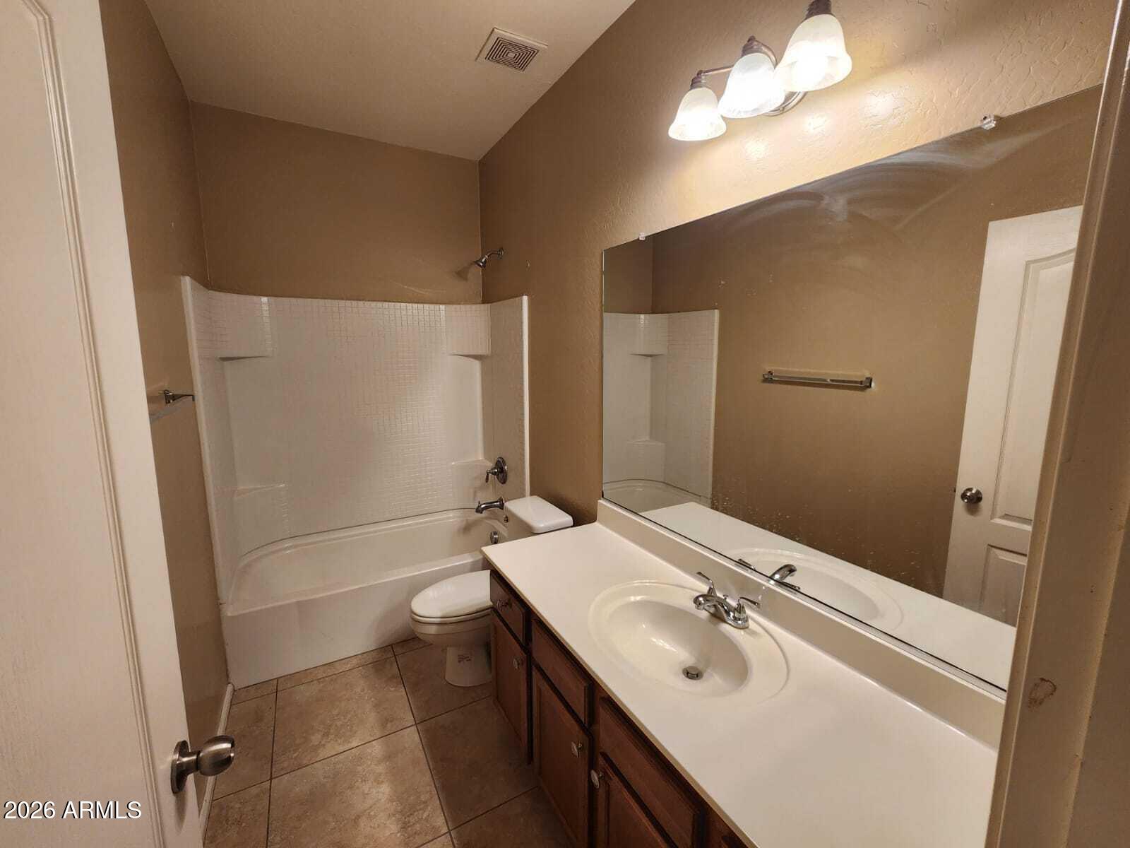 7643 West Charter Oak Road Peoria, AZ 85381 - Photo 19 of 27 a bathroom with a sink a toilet and shower