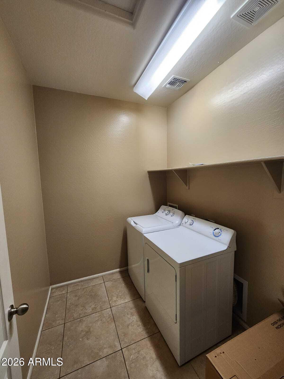 7643 West Charter Oak Road Peoria, AZ 85381 - Photo 22 of 27 a utility room with washer and dryer