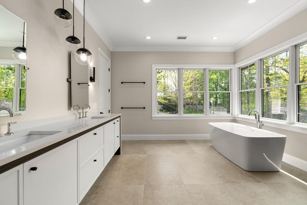 46 Exeter Street Newton, MA 02465 - Photo 35 of 40 a large bathroom with double vanity and a large mirror
