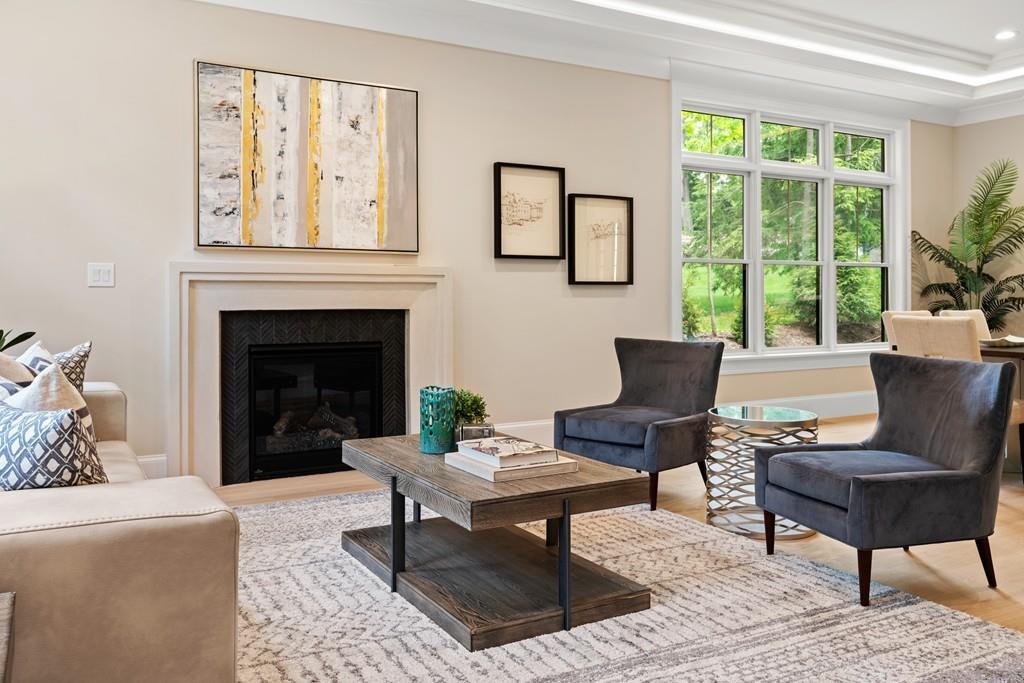46 Exeter Street Newton, MA 02465 - Photo 7 of 40 a living room with furniture a table and a fireplace