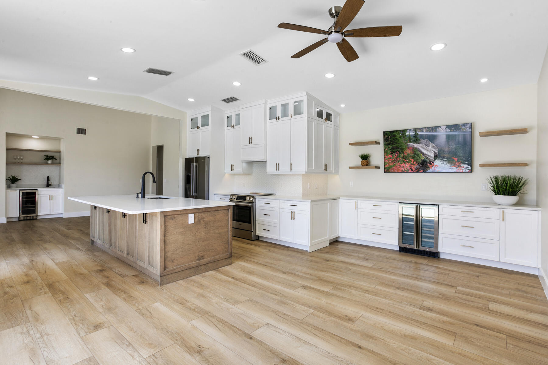 15810 Windrift Drive Jupiter, FL 33477 - Photo 13 of 52 a living room with furniture and a wooden floor
