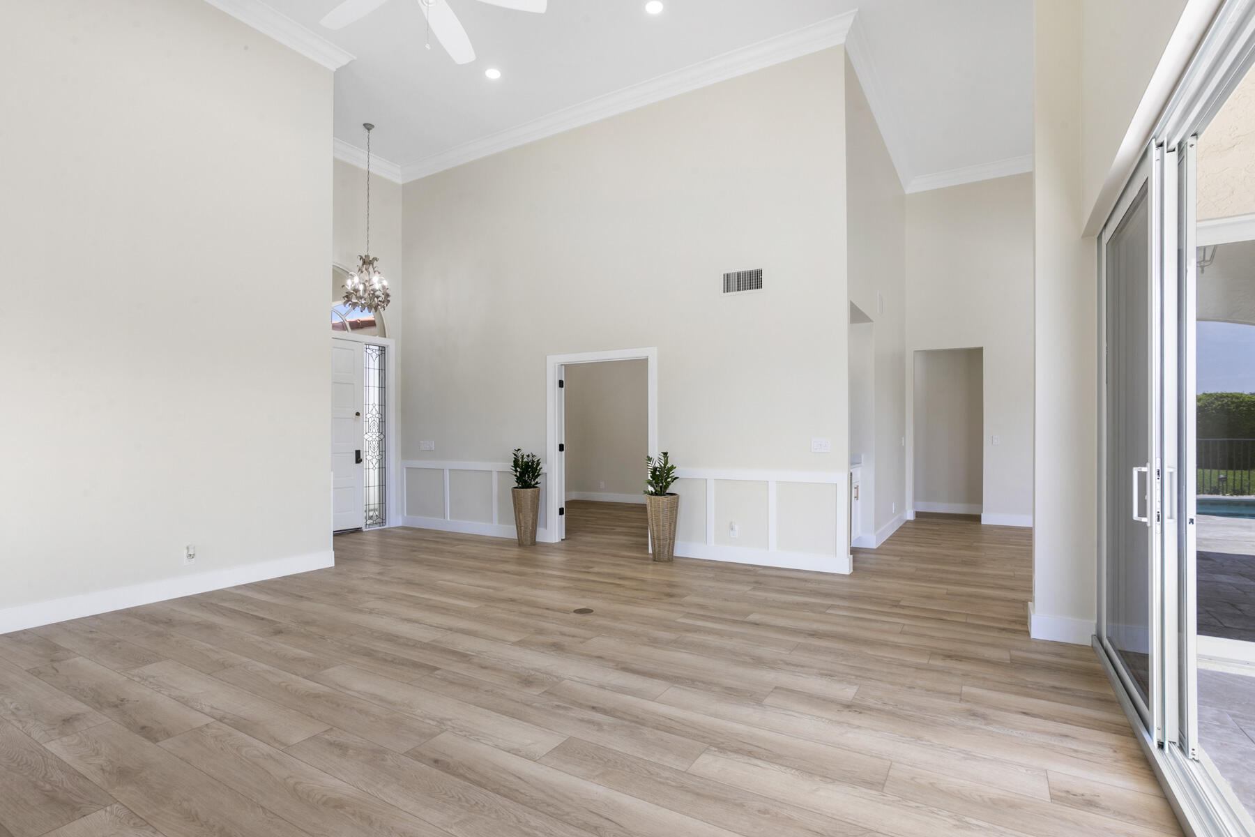 15810 Windrift Drive Jupiter, FL 33477 - Photo 15 of 52 a view of empty room with wooden floor