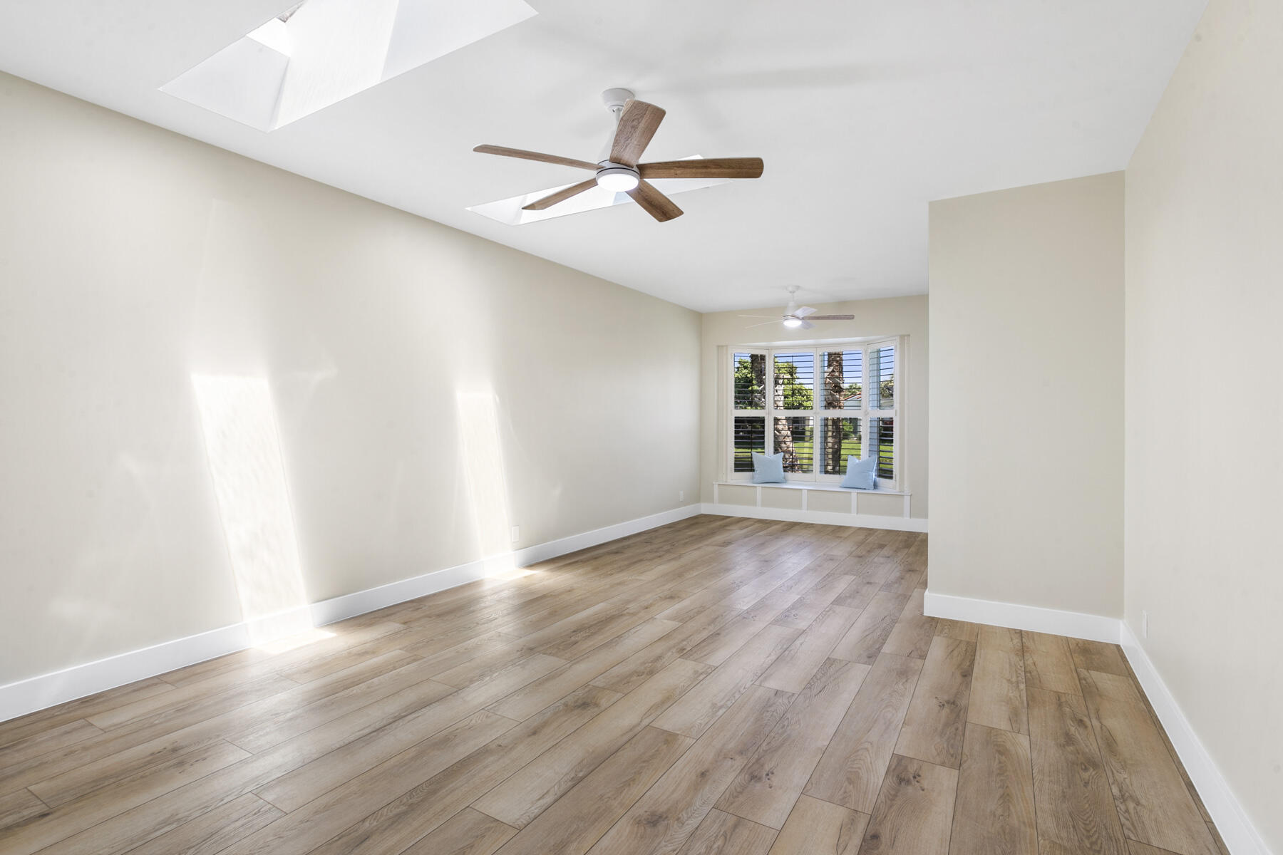 15810 Windrift Drive Jupiter, FL 33477 - Photo 24 of 52 wooden floor in an empty room with a window