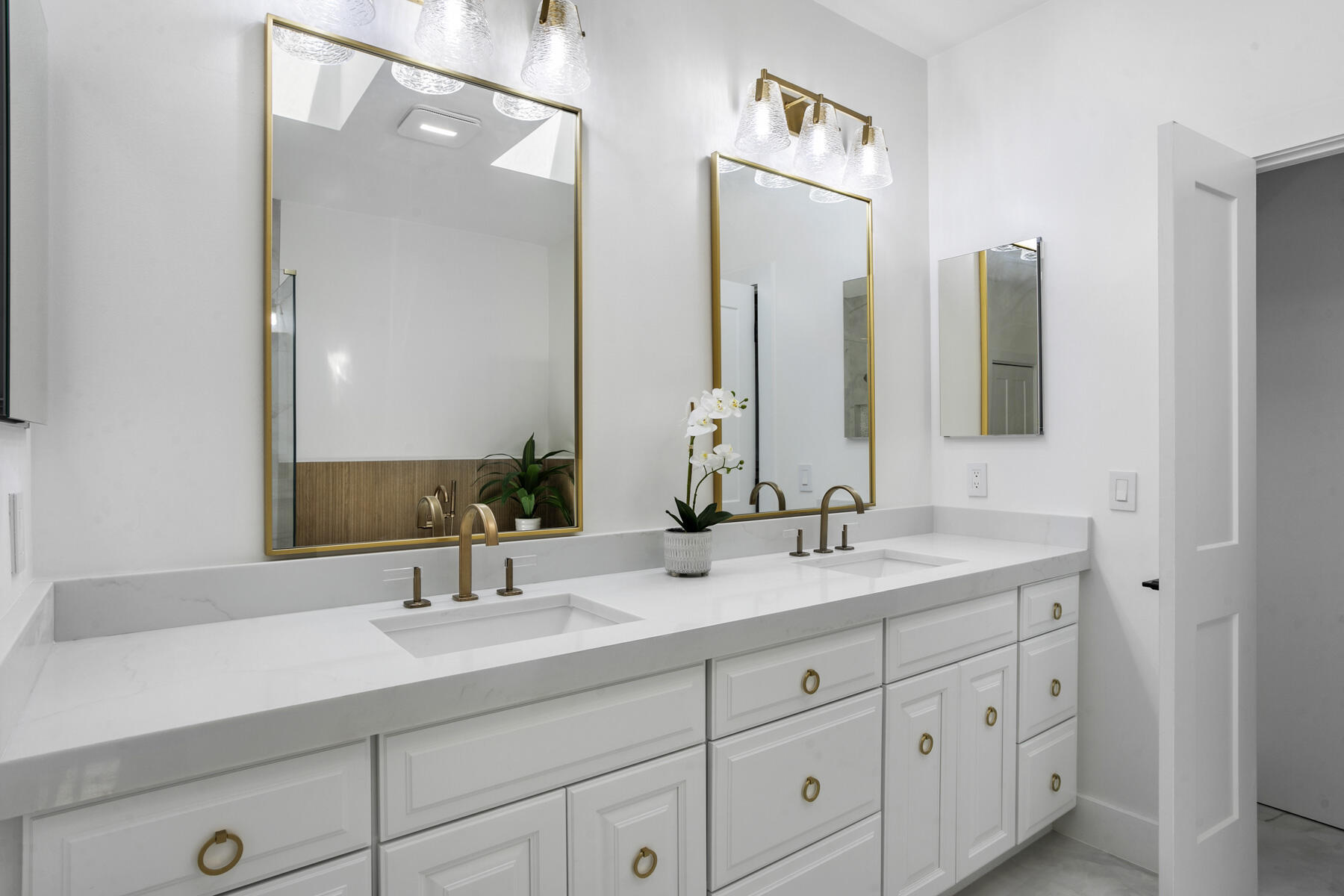 15810 Windrift Drive Jupiter, FL 33477 - Photo 28 of 52 a bathroom with double sink and a mirror