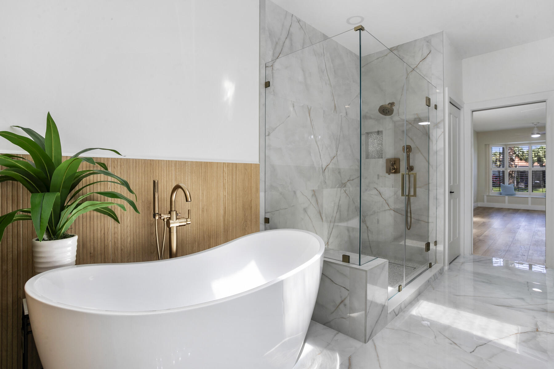 15810 Windrift Drive Jupiter, FL 33477 - Photo 29 of 52 a white bath tub sitting in a bathroom