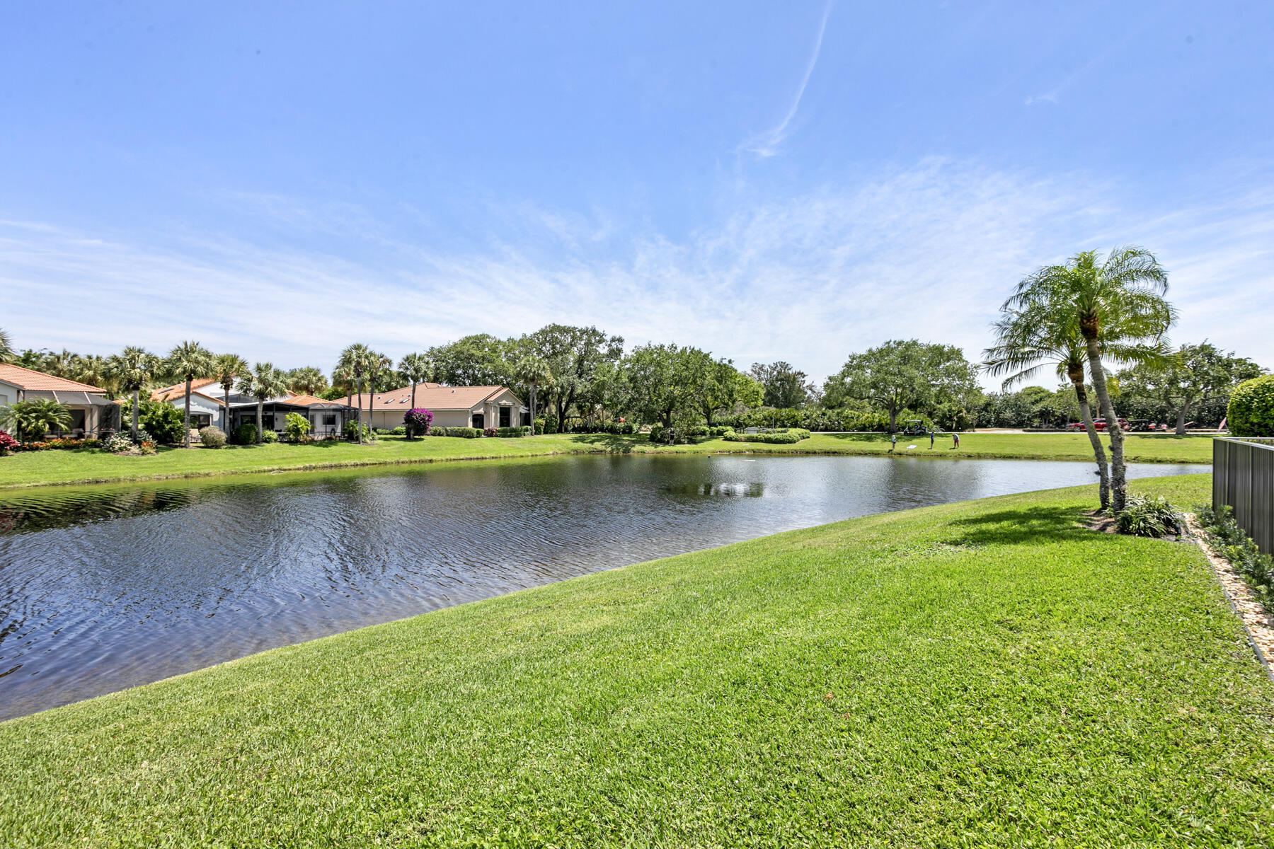 15810 Windrift Drive Jupiter, FL 33477 - Photo 40 of 52 a view of a lake with houses in the back