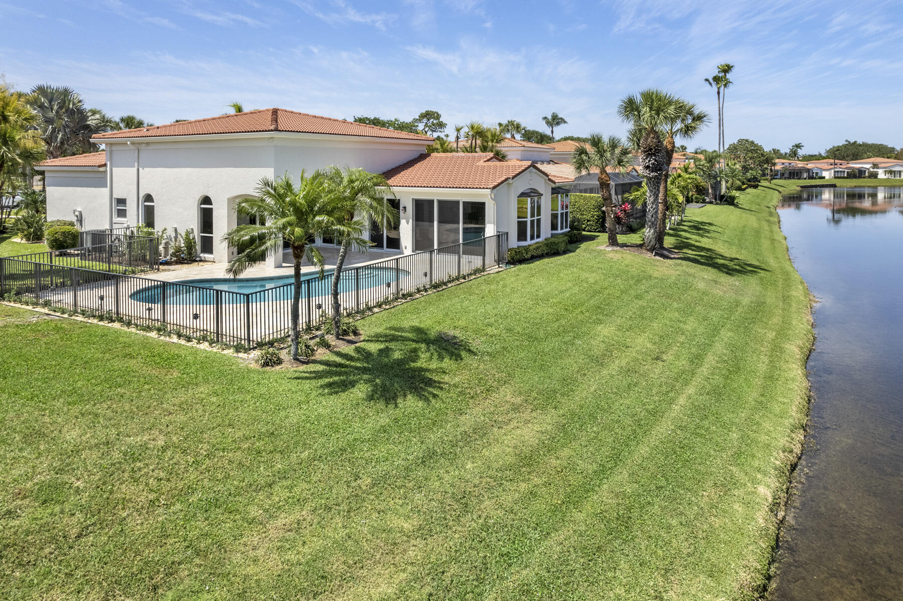 15810 Windrift Drive Jupiter, FL 33477 - Photo 42 of 52 a view of a house with a yard and sitting area