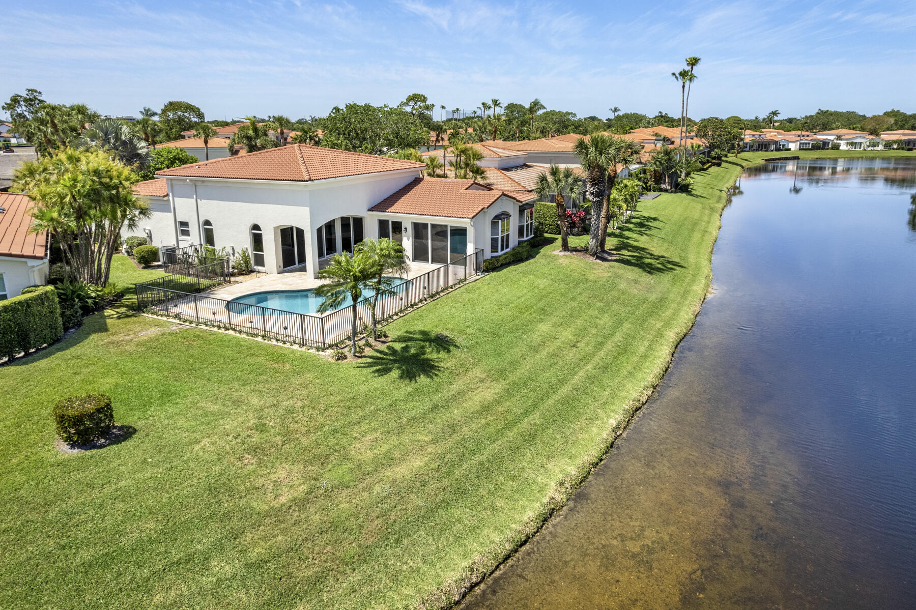 15810 Windrift Drive Jupiter, FL 33477 - Photo 43 of 52 an aerial view of a house with swimming pool patio and outdoor seating