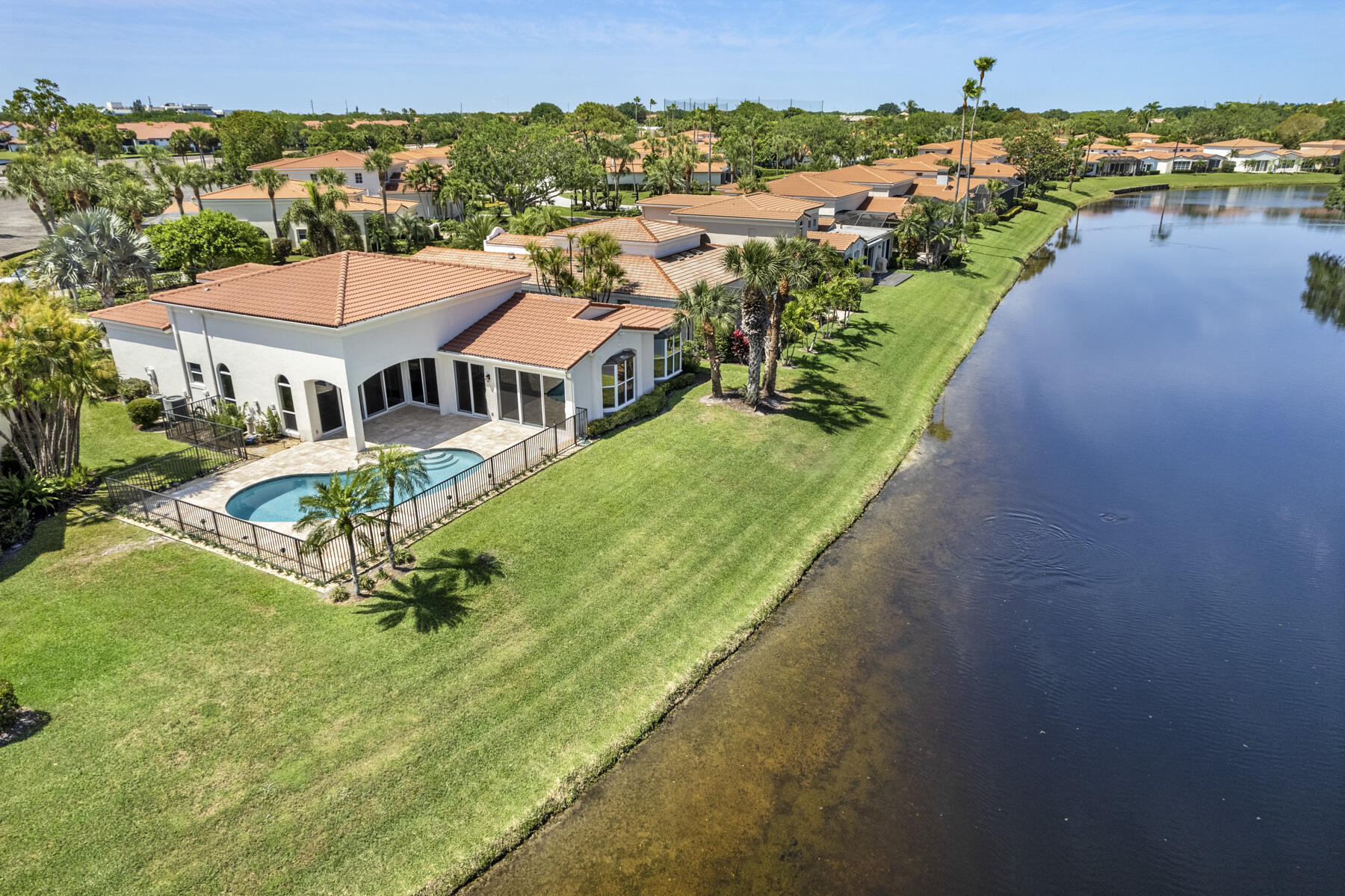 15810 Windrift Drive Jupiter, FL 33477 - Photo 44 of 52 an aerial view of a house with a garden