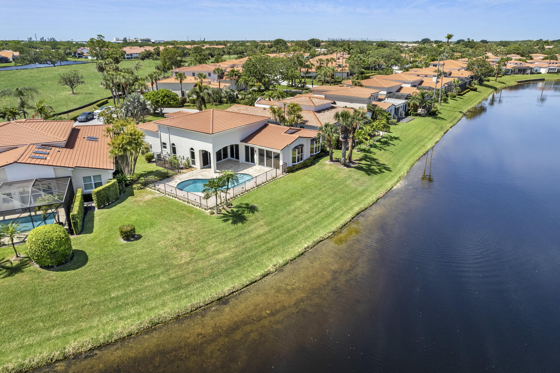 15810 Windrift Drive Jupiter, FL 33477 - Photo 45 of 52 an aerial view of a house with a garden