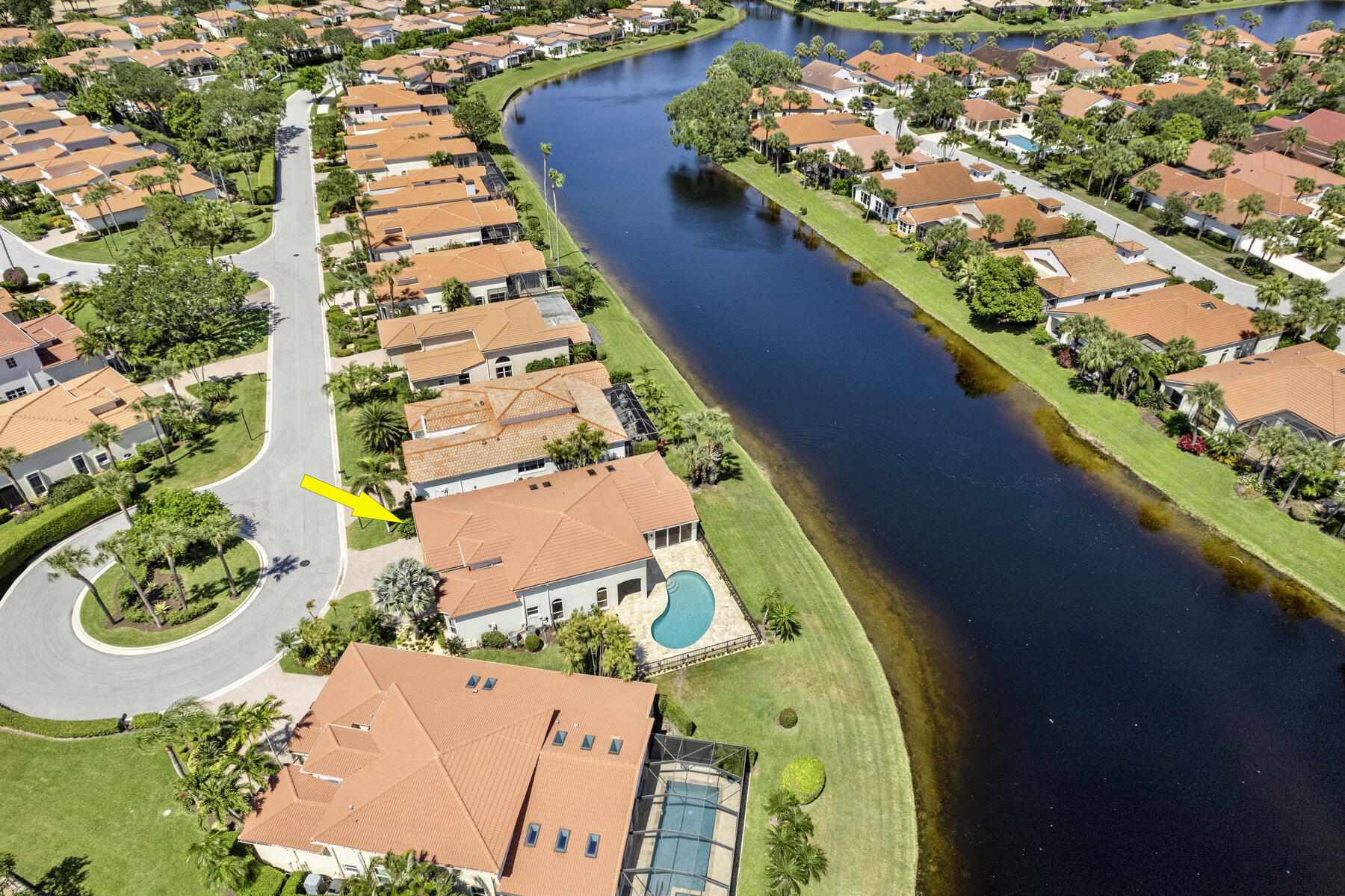15810 Windrift Drive Jupiter, FL 33477 - Photo 47 of 52 an aerial view of swimming pool patio and lake view