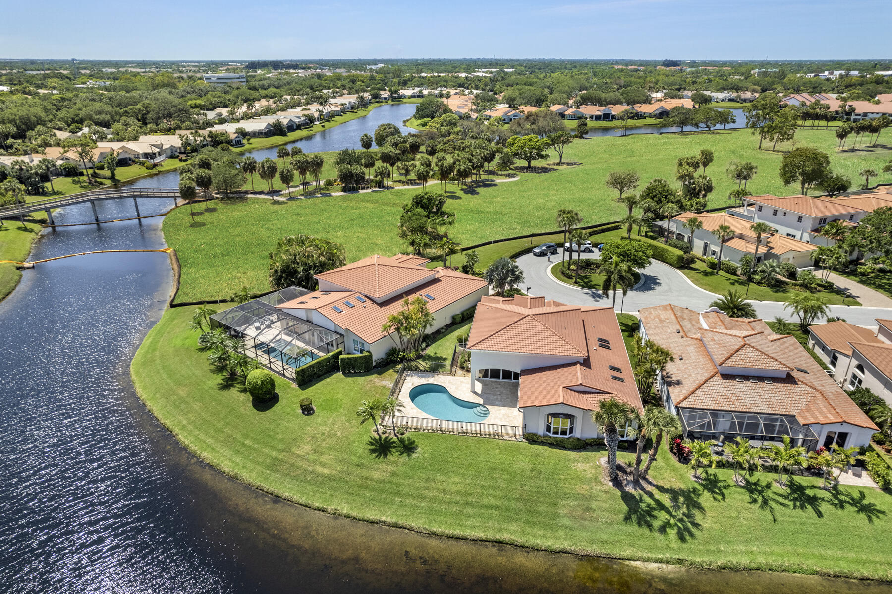 15810 Windrift Drive Jupiter, FL 33477 - Photo 50 of 52 an aerial view of a house with a big yard