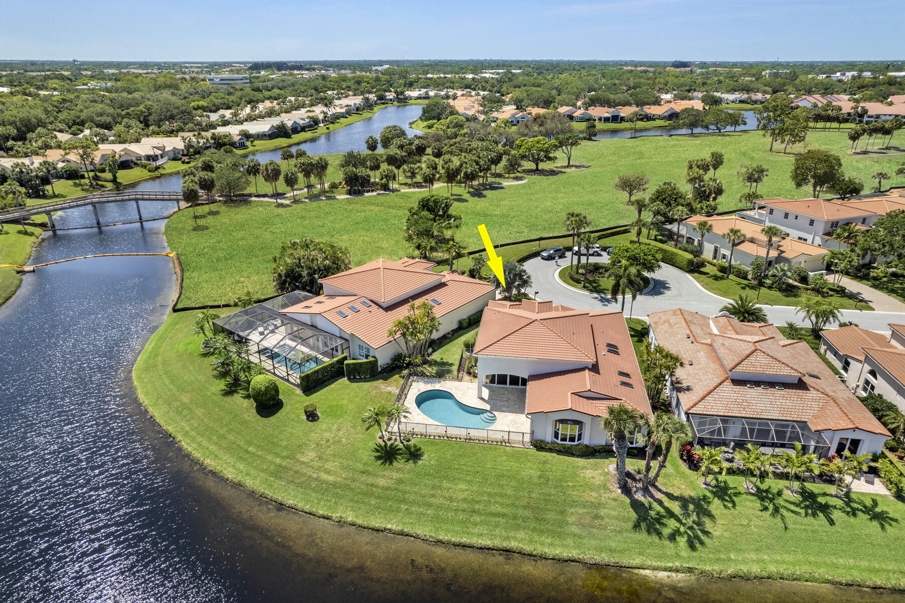 15810 Windrift Drive Jupiter, FL 33477 - Photo 51 of 52 an aerial view of a house with a big yard