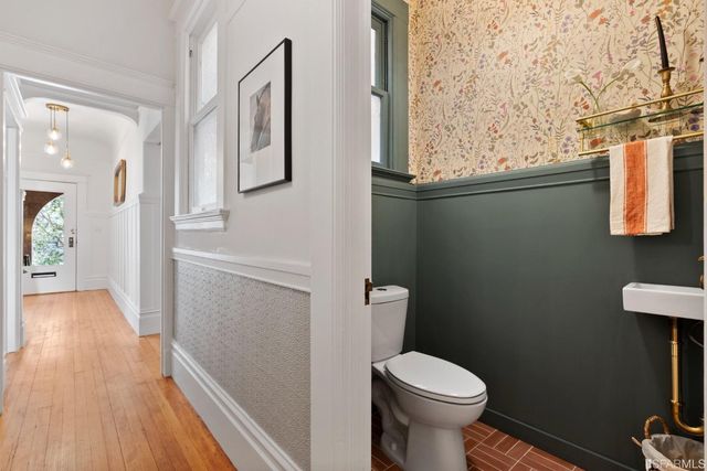 a bathroom with a toilet and a sink