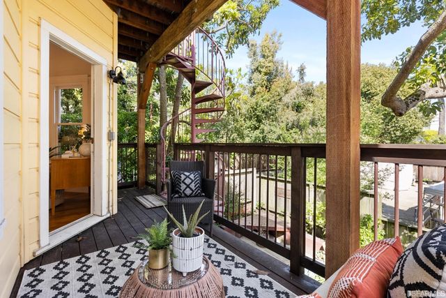 a view of balcony with furniture