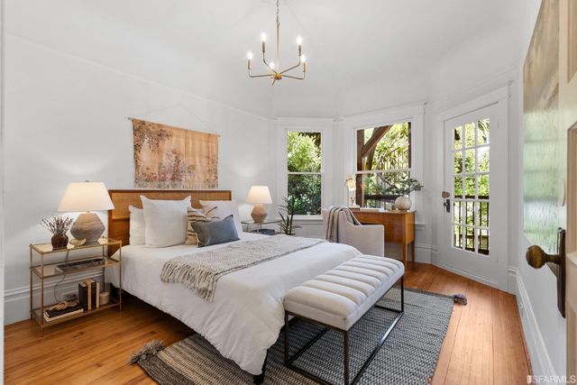 a bedroom with bed and a window