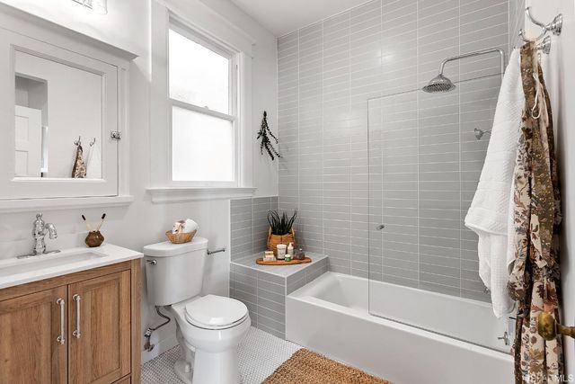 a bathroom with a sink toilet and bathtub