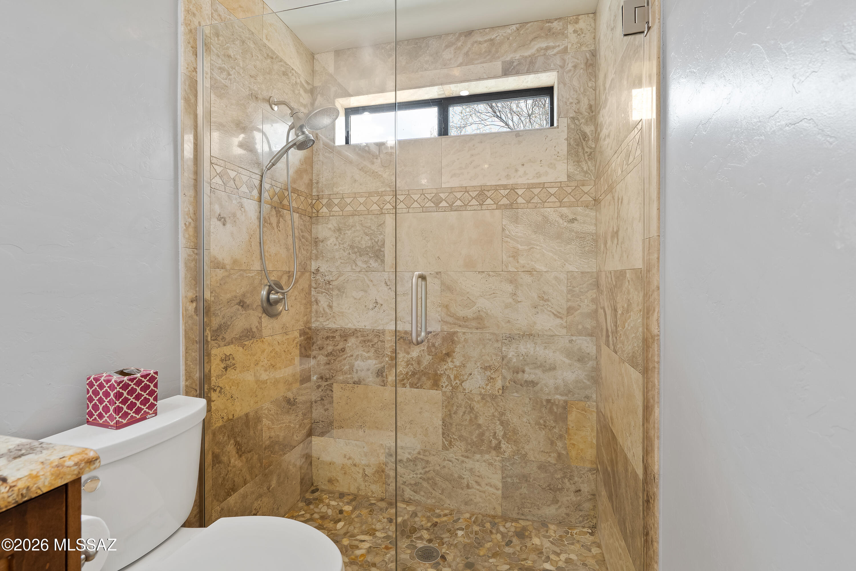9420 East Ravine Trail Tucson, AZ 85749 - Photo 18 of 39 a bathroom with a toilet and a shower
