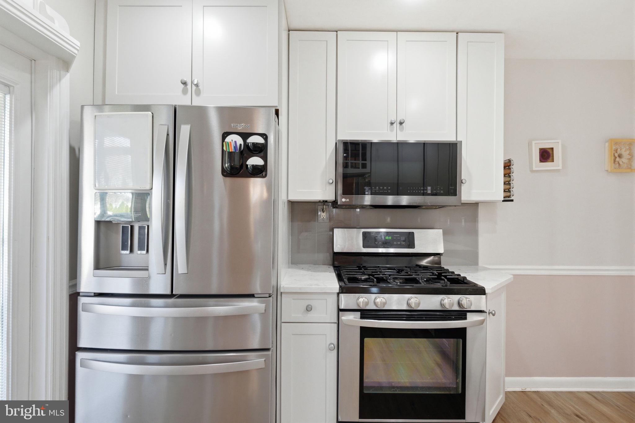 1717 Pennrock Road Wilmington, DE 19809 - Photo 12 of 41 a kitchen with stainless steel appliances a refrigerator stove and microwave