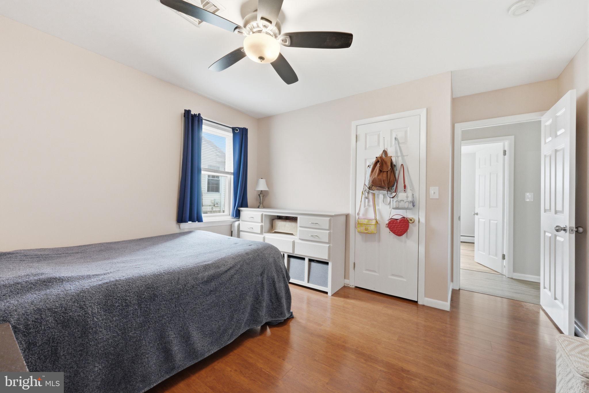 1717 Pennrock Road Wilmington, DE 19809 - Photo 22 of 41 a bedroom with a bed and a chandelier