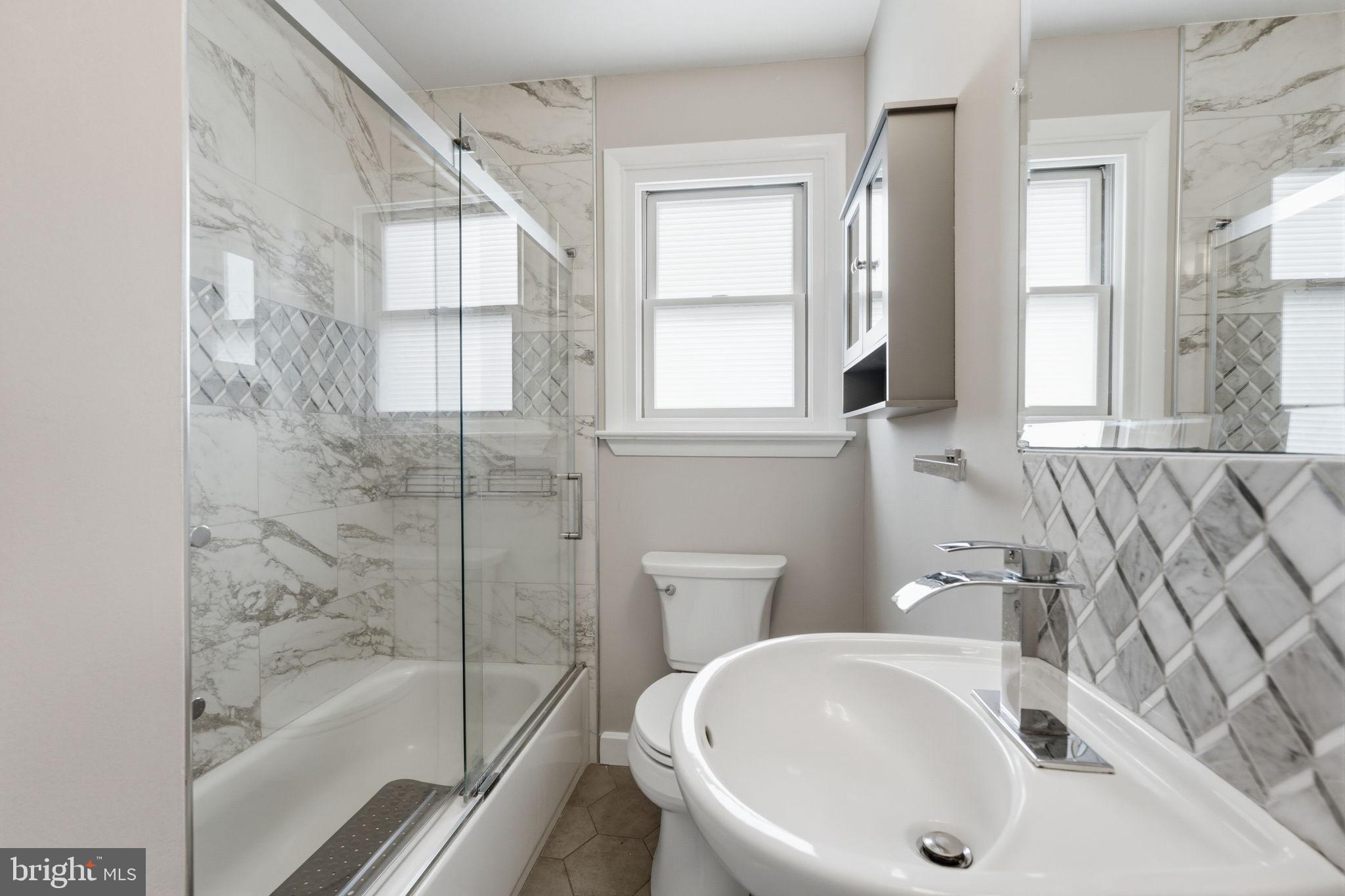 1717 Pennrock Road Wilmington, DE 19809 - Photo 24 of 41 a bathroom with a sink and a bathtub