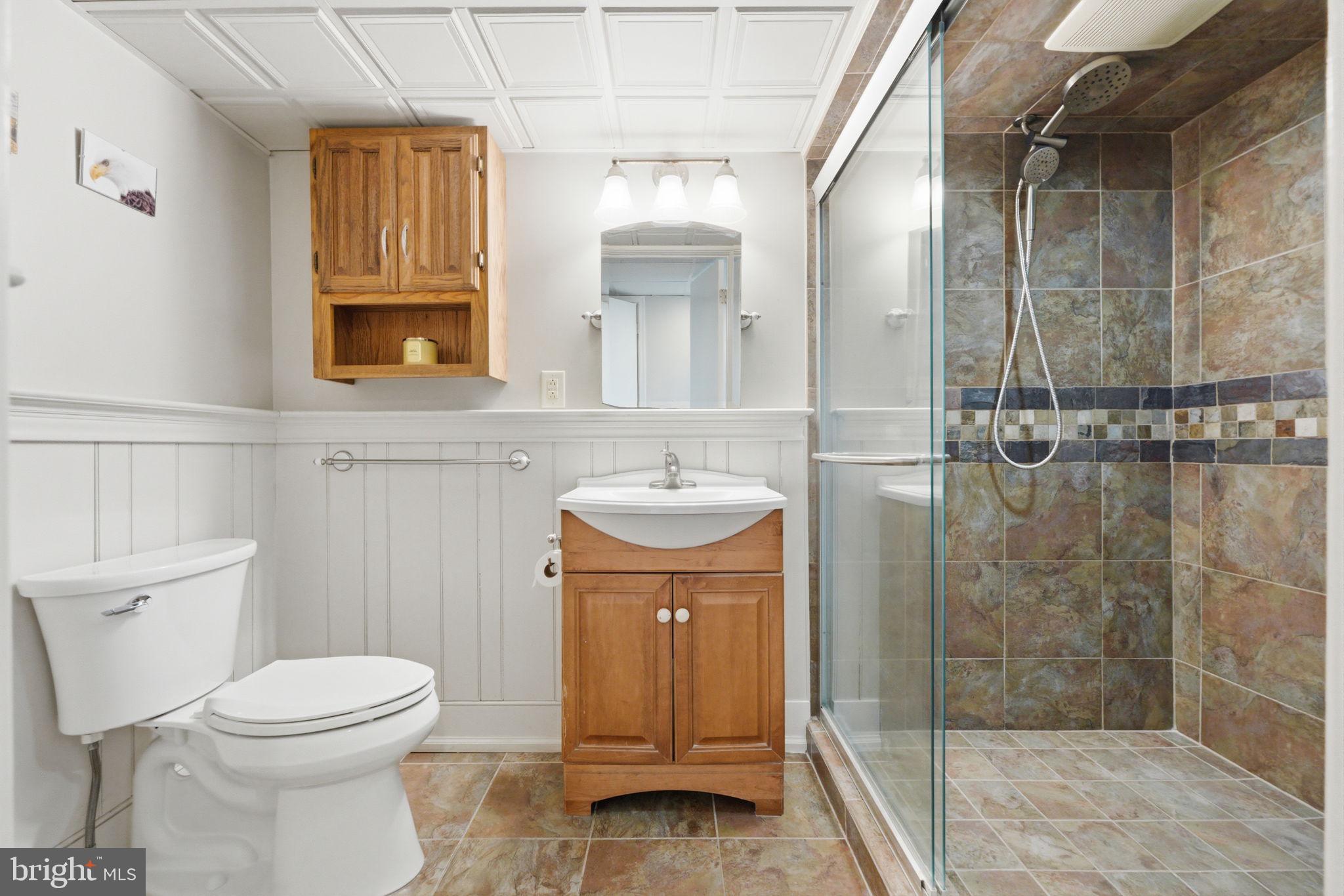 1717 Pennrock Road Wilmington, DE 19809 - Photo 31 of 41 a bathroom with a sink a toilet and shower
