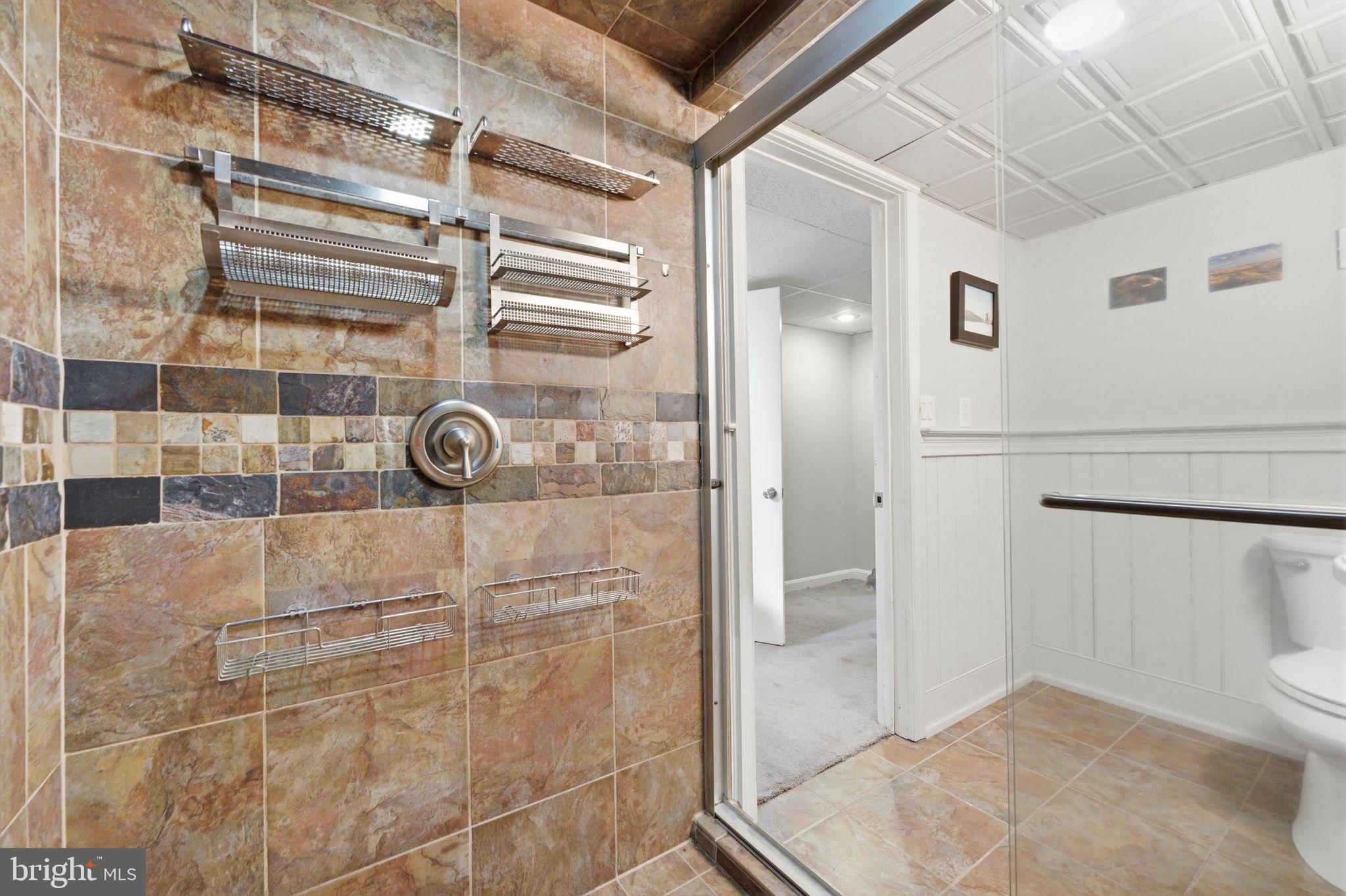 1717 Pennrock Road Wilmington, DE 19809 - Photo 34 of 41 a bathroom with a shower and toilet