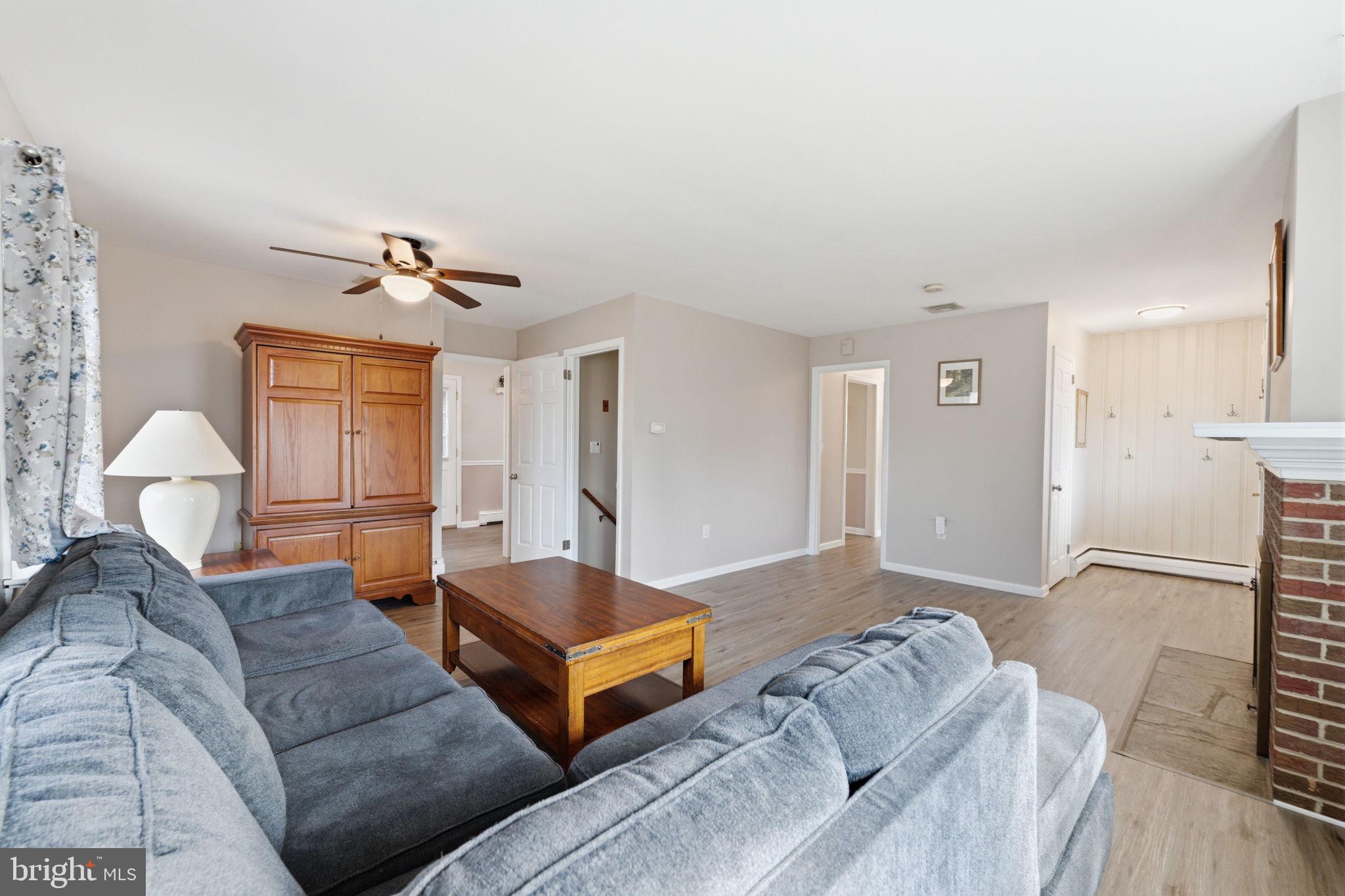 1717 Pennrock Road Wilmington, DE 19809 - Photo 5 of 41 a living room with furniture and a chandelier
