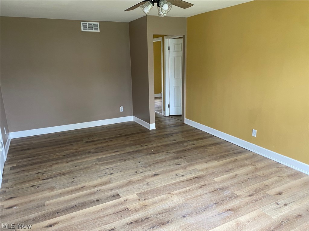 2508 Greenvale Road Cleveland, OH 44121 - Photo 6 of 16 Spare room with wood-type flooring and ceiling fan
