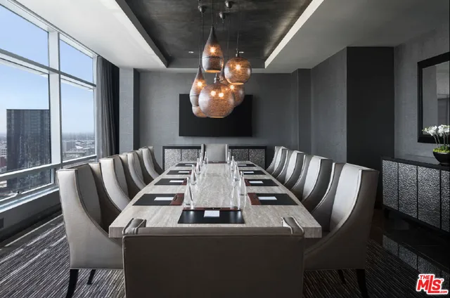 a living room with furniture and a lamp