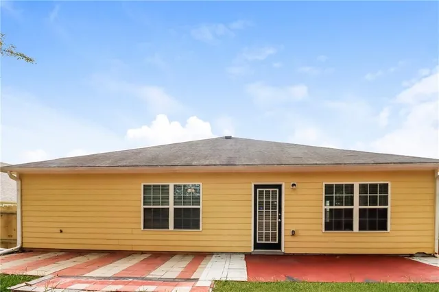 a front view of a house with large windows