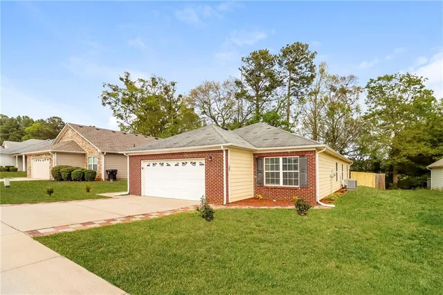 front view of a house with a yard