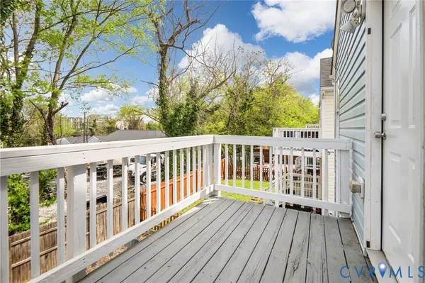 a view of a wooden balcony with staircase