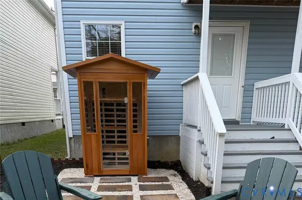 a front view of a house with stairs